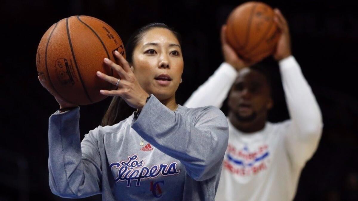 Natalie Nakase. delivering passes during a Clippers pregame warmup, joined the team's video department in 2012.