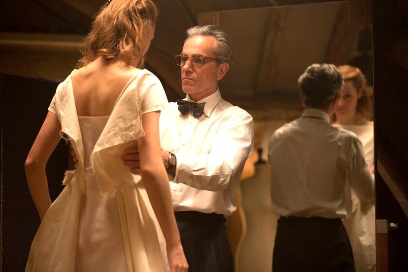 Vicky Krieps, left, and Daniel Day-Lewis star in director Paul Thomas Anderson's "PHANTOM THREAD," a Focus Features release. Credit: Laurie Sparham / Focus Features