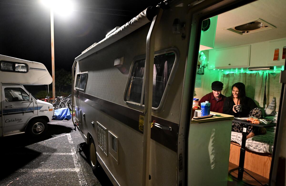 Cal Poly Humboldt students study in a camper parked in a lot on campus in Arcata, Calif., on Nov. 17. 