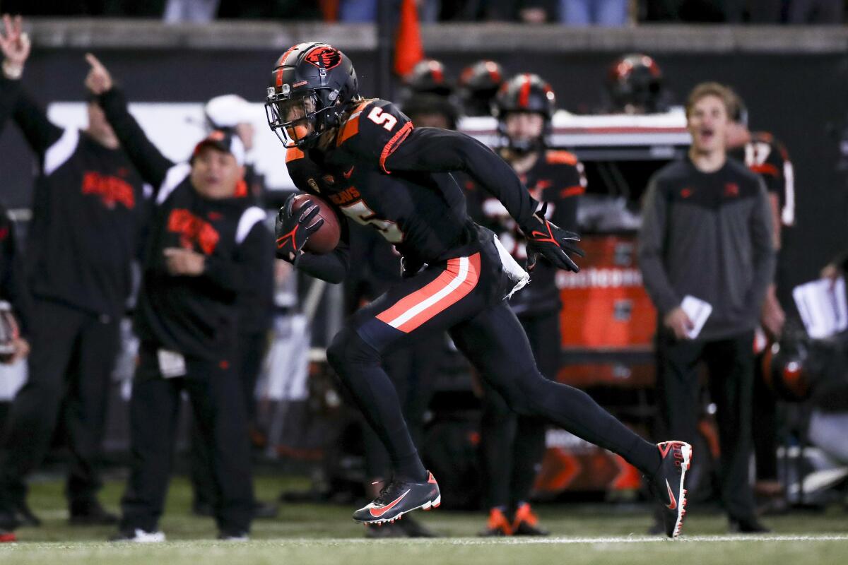 Oregon State defensive back Alex Austin rushes 42 yards to score a touchdown after an interception during the second half of an NCAA college football game against Colorado on Saturday, Oct. 22, 2022, in Corvallis, Ore. (AP Photo/Amanda Loman)