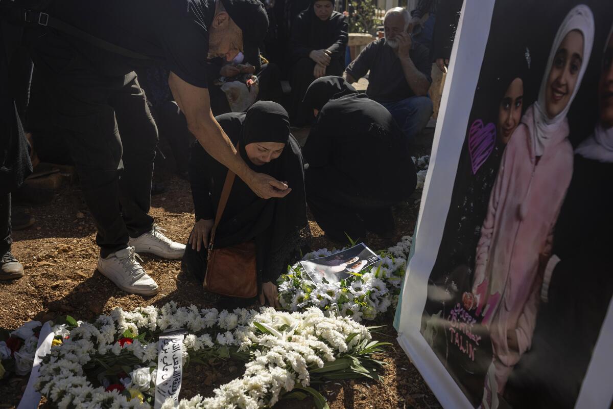 Blida, Lebanon. November 7, 2023. Relatives of Remas, Taleen and Layan Mahmoud Shor during their burial in South Lebanon.