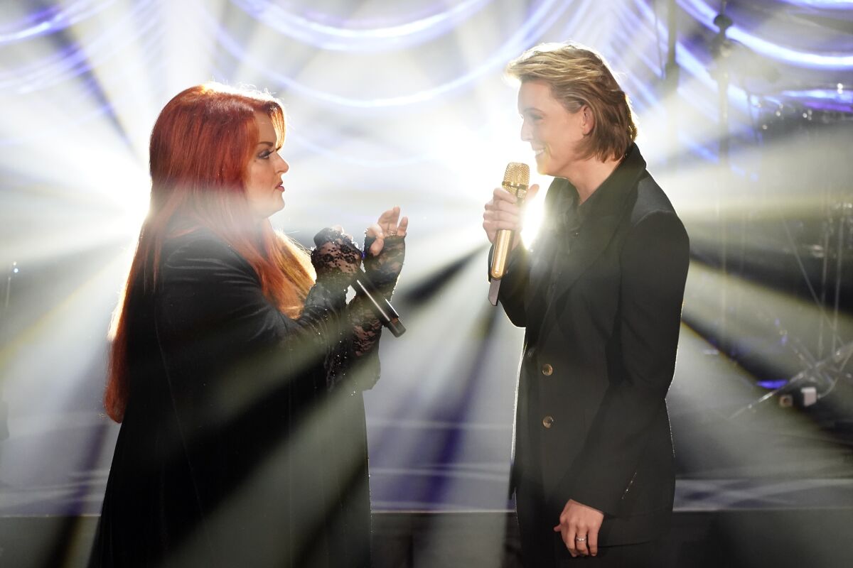 Wynonna Judd, left, and Brandi Carlile sing "The Rose," during a tribute to country music star Naomi Judd, Sunday, May 15, 2022, in Nashville, Tenn. Naomi Judd died April 30. She was 76. (AP Photo/Mark Humphrey)