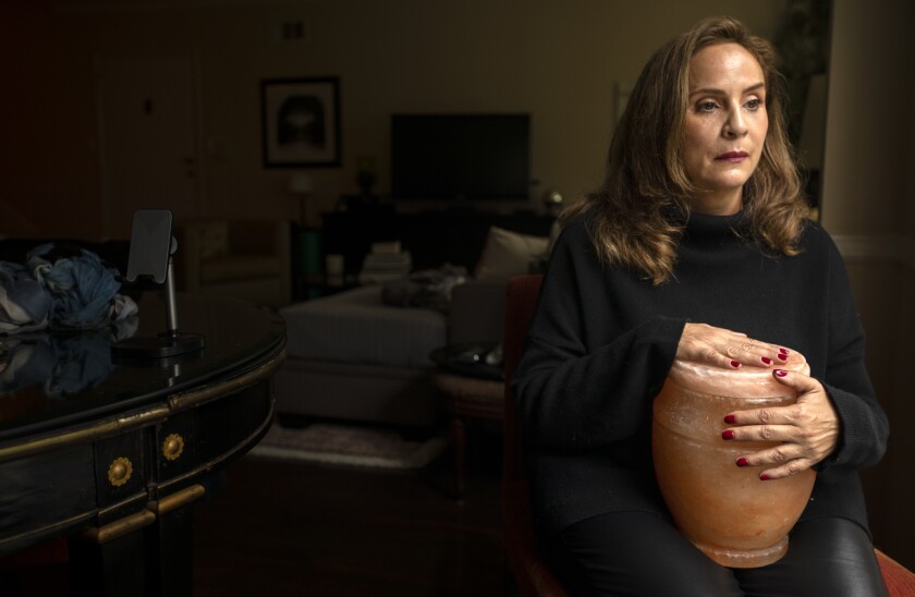 Helena Apotaker Holds Her Mother'S Urn In West Hollywood. 