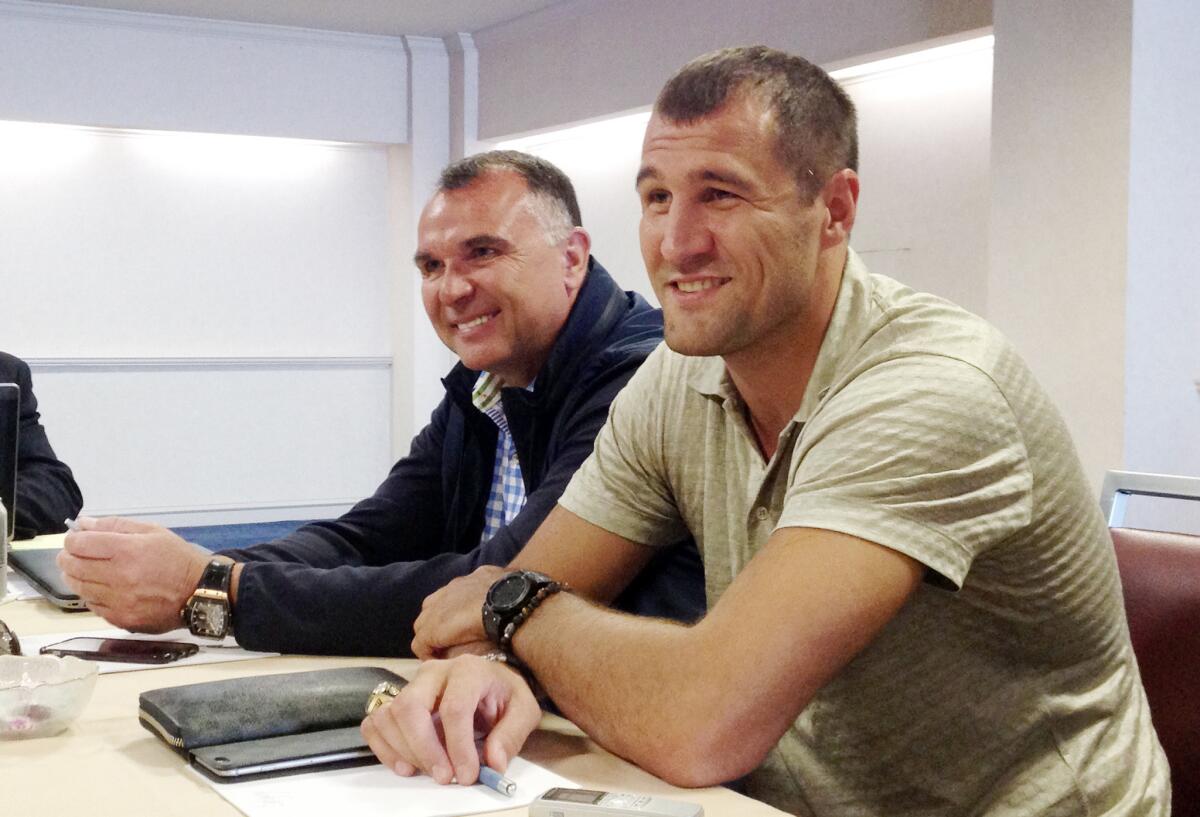 Light heavyweight champion Sergey Kovalev, right, participates in an April press conference with manager Egis Klimas.
