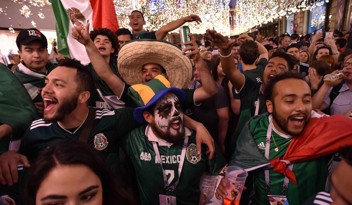 Mexico fans celebrate their team's victory outside the Kremlin on June 17 in Moscow.