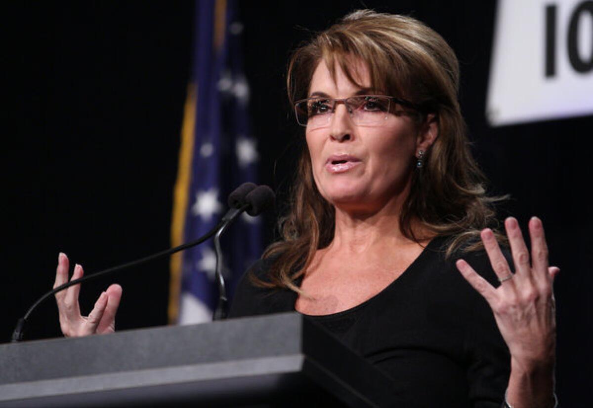 Former Alaska Gov. Sarah Palin speaks during the Iowa Faith & Freedom Coalition's Friends of the Family Banquet in Des Moines, Iowa, on Nov. 9.