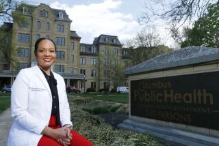 Dr. Mysheika W. Roberts, the health commissioner for Columbus Public Health, poses for a portrait in Columbus, Ohio, on Wednesday, April 14, 2021. Public health officials who have juggled bare-bones budgets for years are happy to have the additional money prompted by the COVID-19 pandemic. Yet they worry it will soon dry up as the pandemic recedes, continuing a boom-bust funding cycle that has plagued the U.S. public health system for decades. If budgets are slashed again, they warn, that could leave the nation where it was before covid: unprepared for a health crisis. “We need funds that we can depend on year after year,” says Roberts. (AP Photo/Paul Vernon)