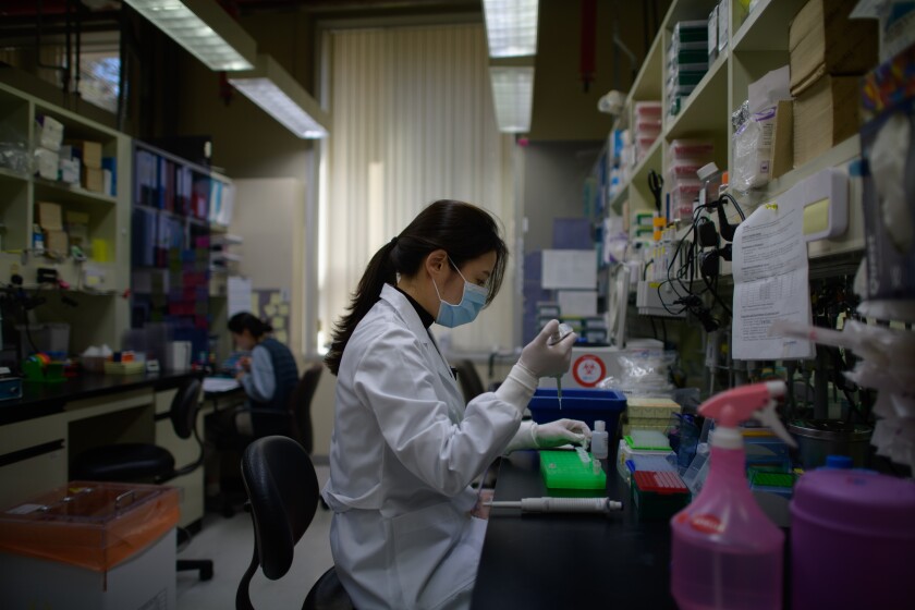 A lab technician works on an antibody test on the Middle Eastern Respiratory Syndrome coronavirus in Seoul. The country’s experience with MERS informed the rapid scaling-up of proactive testing for the new coronavirus.