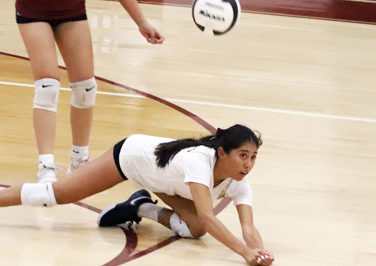 Ocean View's Isabel Escuro (4) dives to keep the ball in play against Westminster on Wednesday.