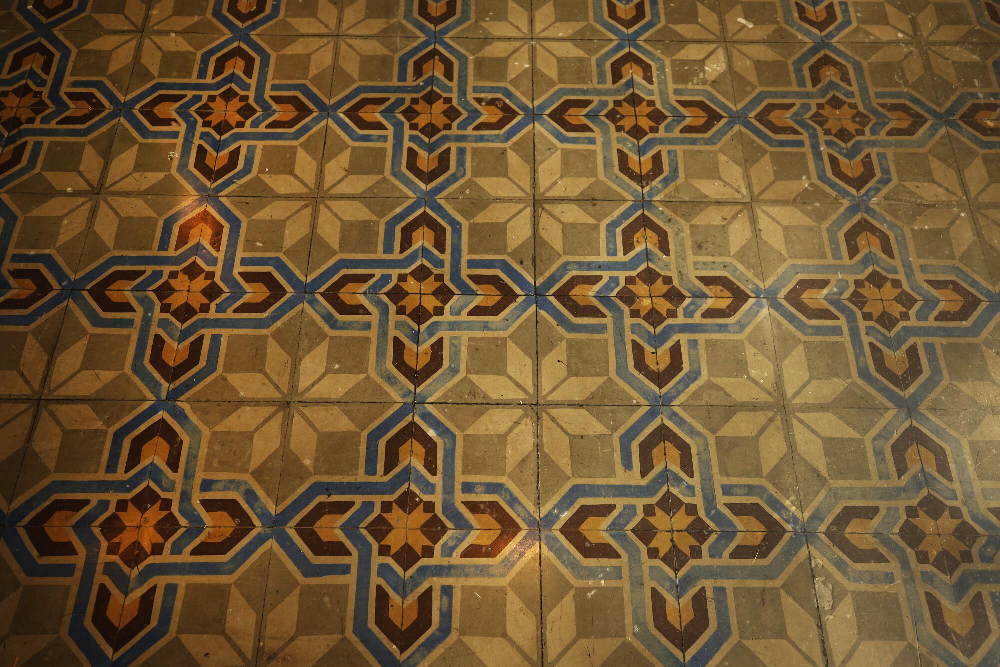 A vintage tile floor in a geometric pattern 