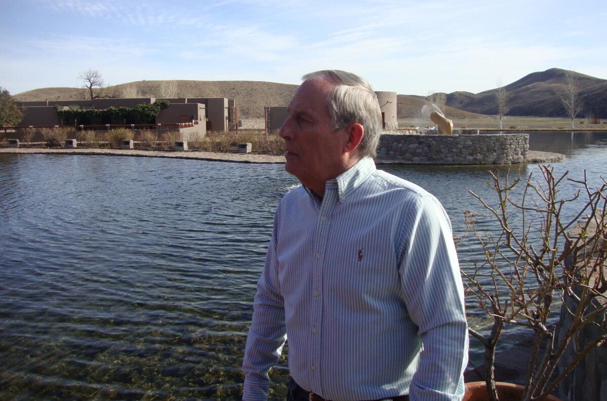 George Van Etten, a property manager at the Cibolo Creek Ranch in Texas, shows reporters around the resort.