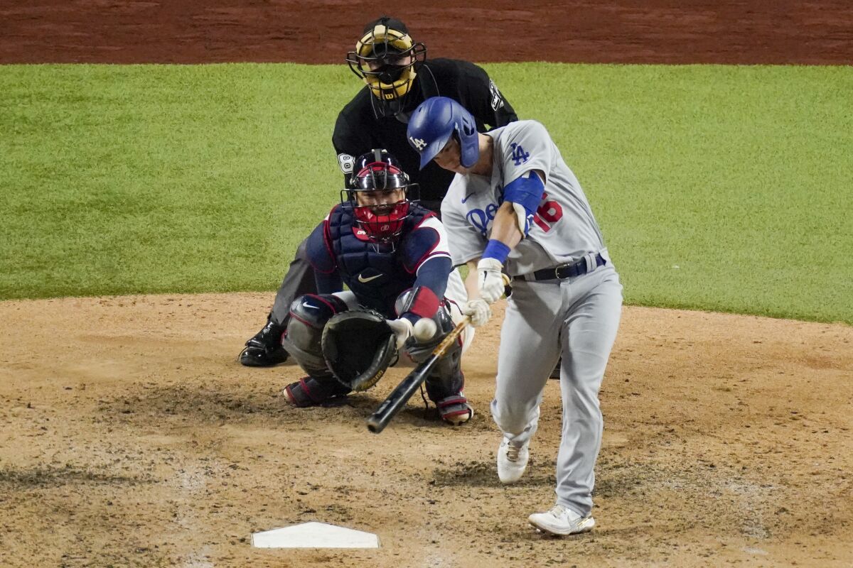 Dodgers catcher Will Smith hits a three-run home run during the sixth inning of Game 5.