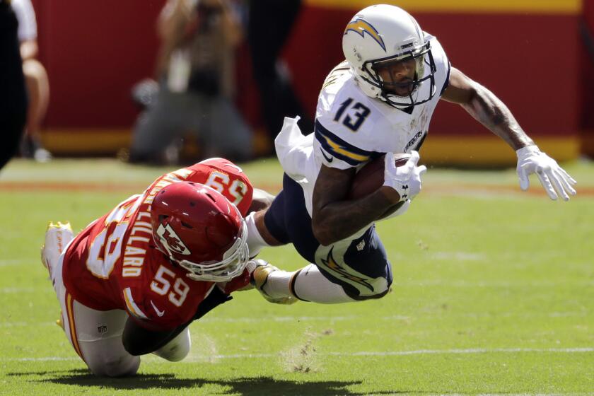San Diego Chargers wide receiver Keenan Allen (13) is tackled by Kansas City Chiefs linebacker Justin March (59) during the first half of an NFL football game in Kansas City, Mo., Sunday, Sept. 11, 2016. (AP Photo/Charlie Riedel)