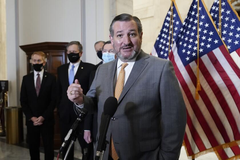 In the file photo from Wednesday, March 24, 2021, Sen. Ted Cruz, R-Texas, joins other Senate Republicans.