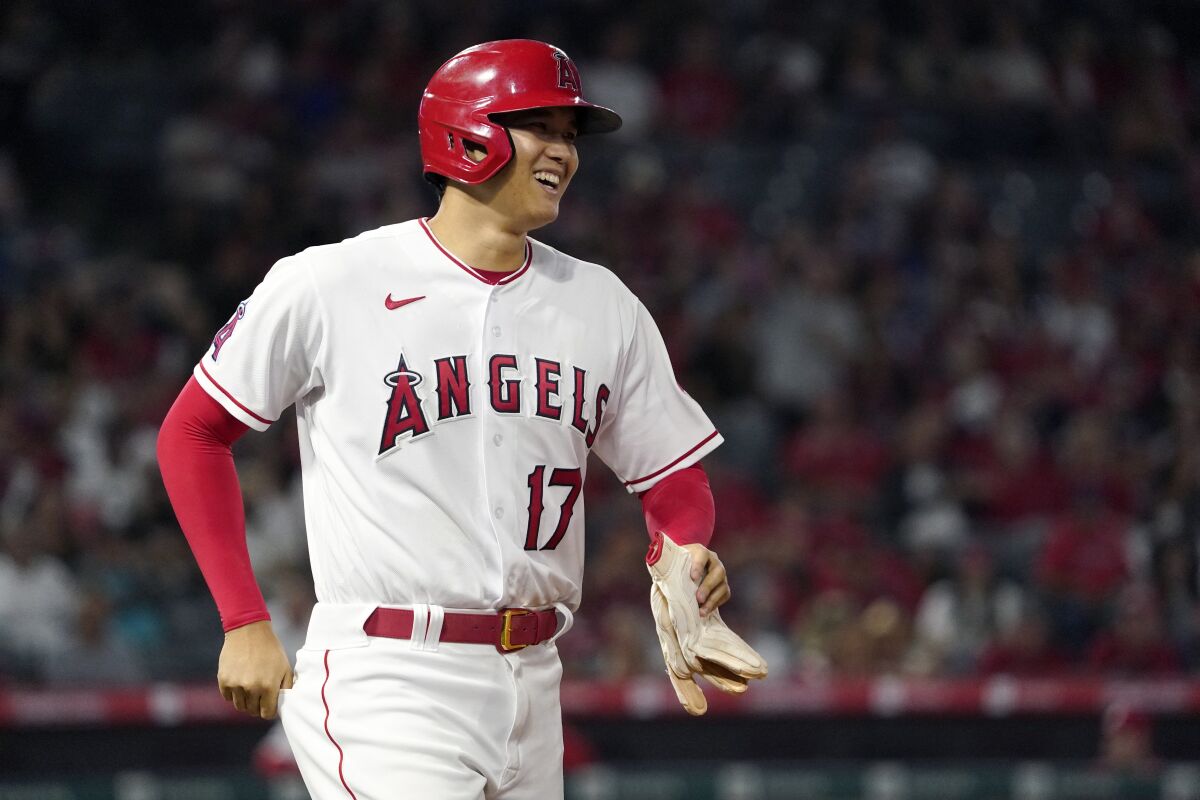Los Angeles Angels' Shohei Ohtani smiles after being intentionally walked during the sixth inning of a baseball game against the Baltimore Orioles Saturday, July 3, 2021, in Anaheim, Calif. (AP Photo/Mark J. Terrill)