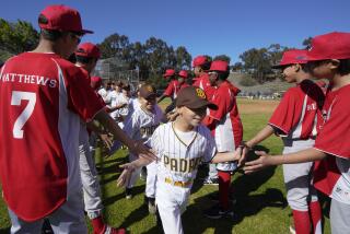 San Diego, CA - February 26: Opening Day for the Sunshine Little League at Ridgeview / Webster Community on Saturday, Feb. 26, 2022 in San Diego, CA., kicked off with player introductions and a run through a gauntlet of high players in the league. (Nelvin C. Cepeda / The San Diego Union-Tribune)