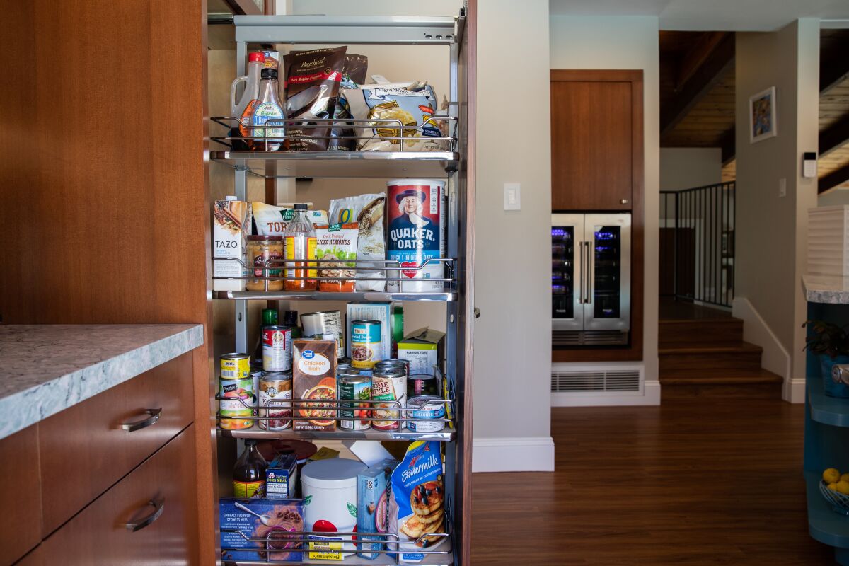 Pull-out pantry shelving in a remodeled kitchen.