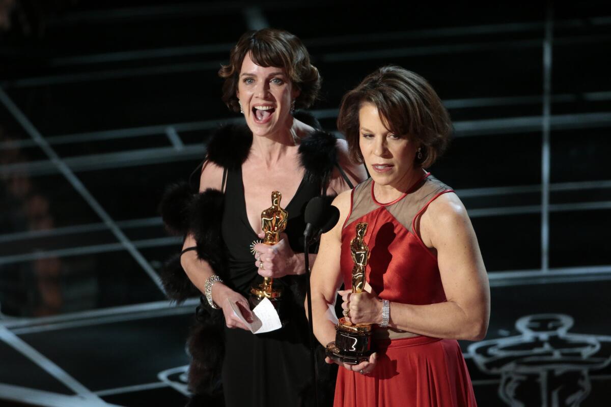 Dana Perry, left, and Ellen Goosenberg Kent with their Oscars for documentary short film.