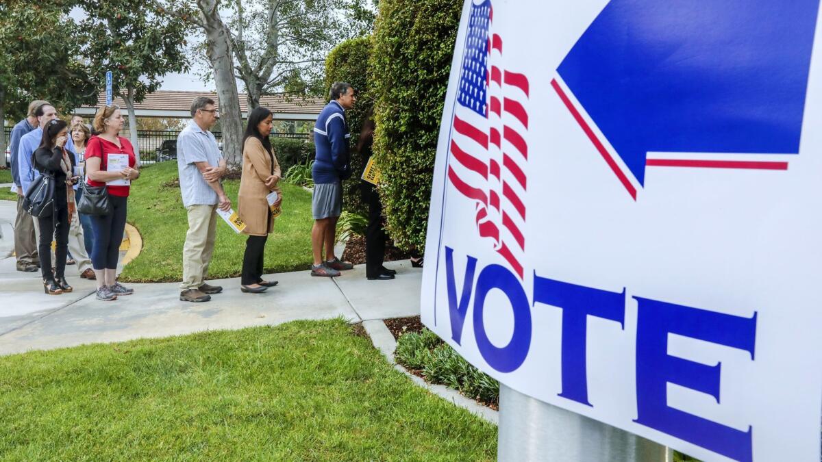 People lined up to casts their ballots in Yorba Linda on Nov. 6, 2018. California's campaign watchdog agency may soon consider limits on disclosure of campaign investigations in the weeks leading up to election day.