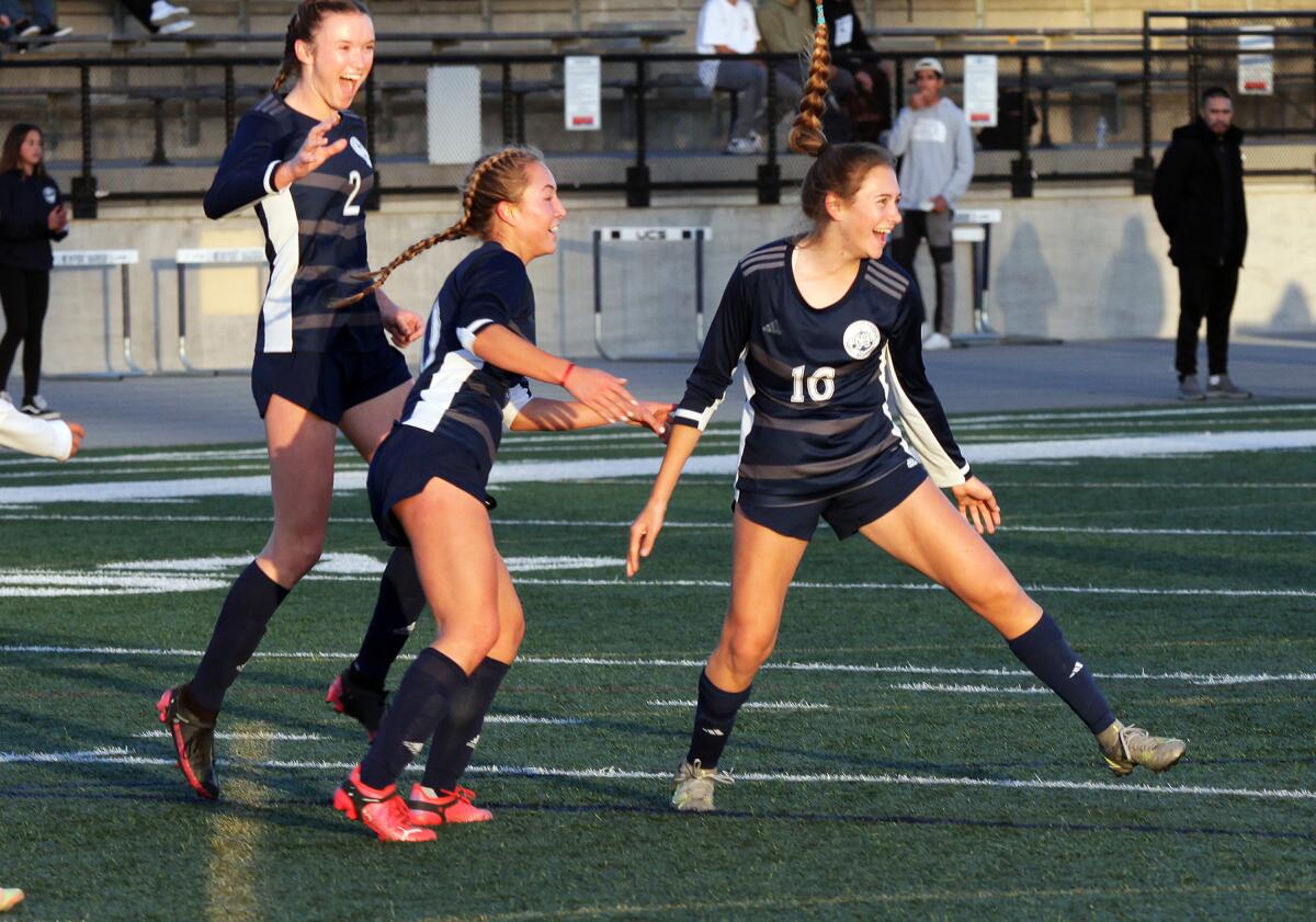 Newport Harbor's Sadie Hoch (16) celebrates after scoring the first goal of the game against Capistrano Valley on Wednesday.