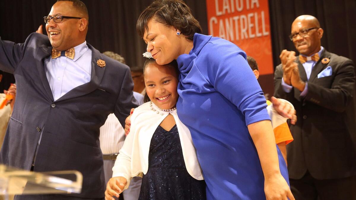 LaToya Cantrell hugs her daughter RayAnn as she celebrates her victory in the New Orleans mayoral election on Nov. 18.