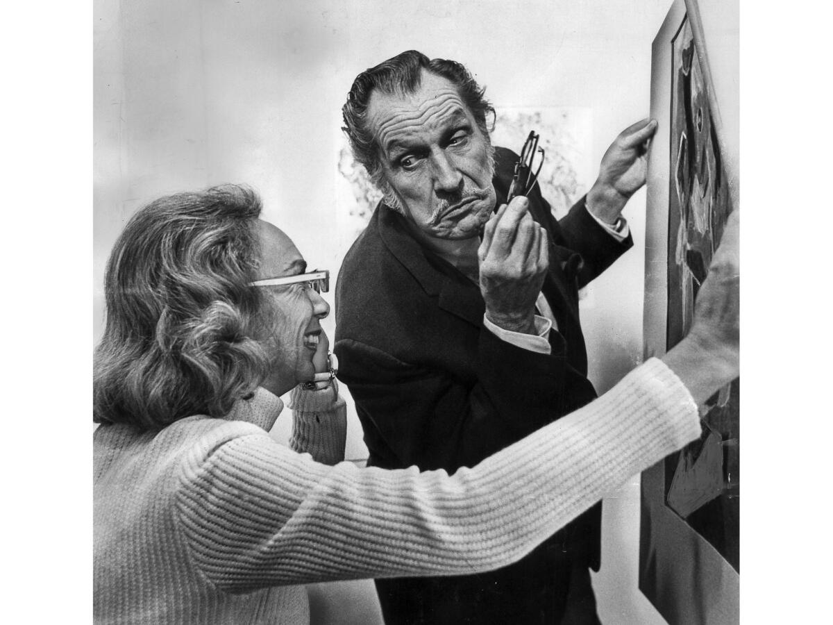 Nov. 30, 1972: Actor Vincent Price and Joan F. Hood exchange comments about a painting at a sale sponsored by Friends of the Junior Arts Center at Barnsdall Park.
