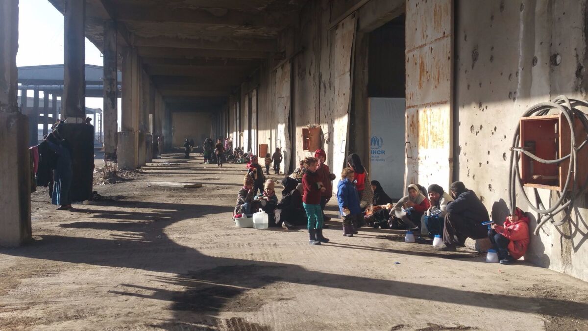 People outside the shelter in Jibreen, Syria.