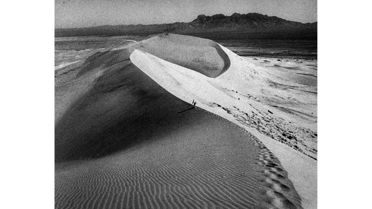 Oct. 16, 1976: Jack Hereford makes his way up the giant sandy Kelso Dunes during an investigation of mysterious sounds.