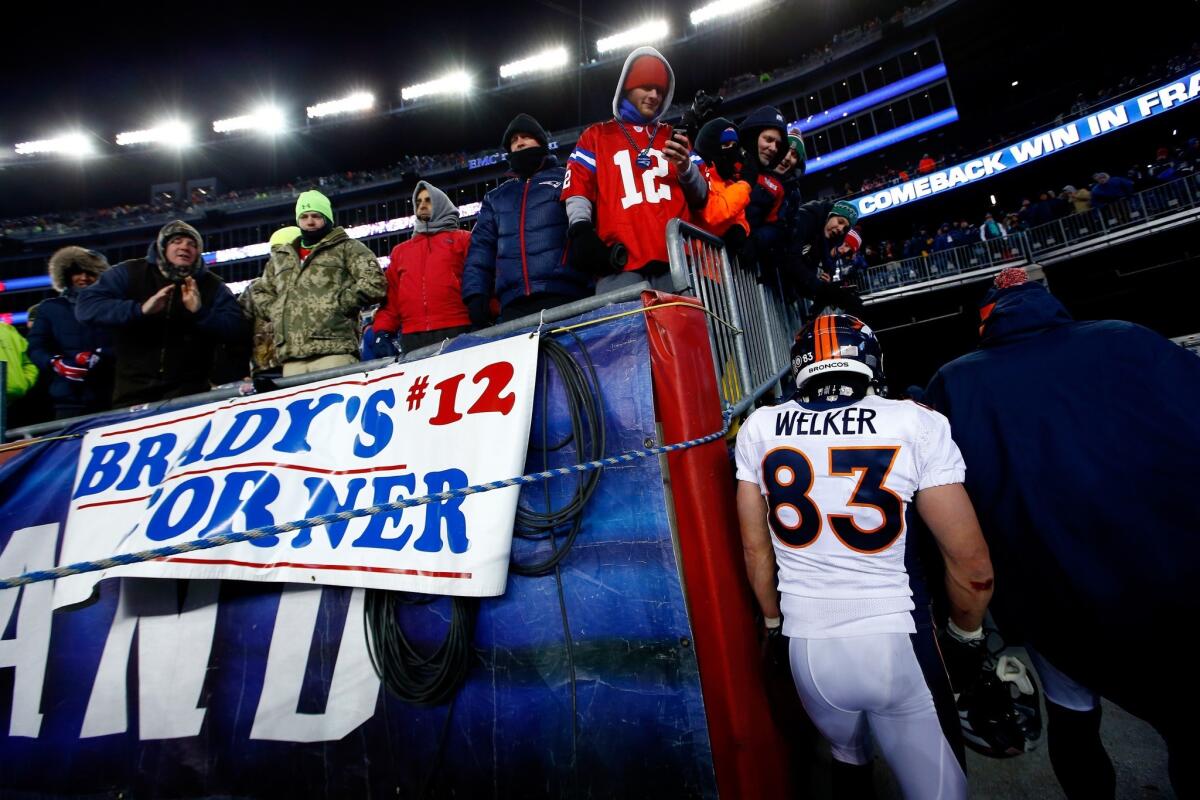 Denver receiver Wes Welker, a former New England player, leaves the field after the Broncos' 34-31 overtime loss to the Patriots at Gillette Stadium on Sunday night.