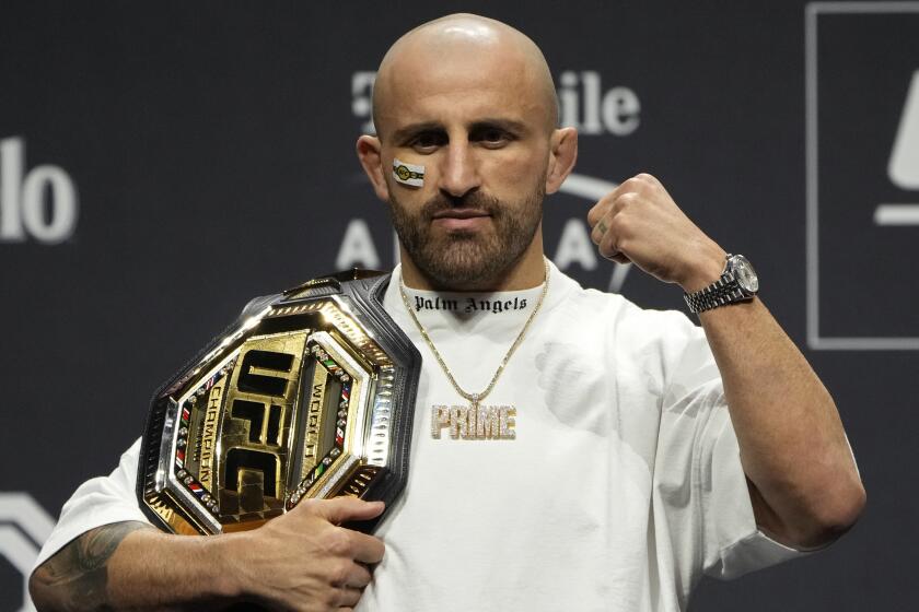 Alexander Volkanovski celebrates during a news conference for the UFC 290 Mixed Martial arts event Thursday, July 6, 2023, in Las Vegas. Volkanovski is scheduled to fight Yair Rodriguez in a featherweight championship bout Saturday in Las Vegas. (AP Photo/John Locher)