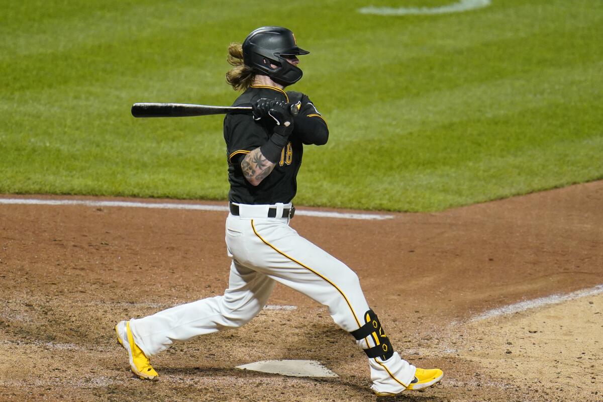 Pittsburgh Pirates' Ben Gamel follows through on a two-run single off Detroit Tigers relief pitcher Alex Lange during the sixth inning of a baseball game in Pittsburgh, Tuesday, Sept. 7, 2021. (AP Photo/Gene J. Puskar)