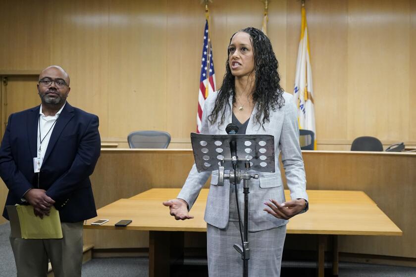 San Francisco District Attorney Brooke Jenkins, right, speaks at a news conference after Nima Momeni's arraignment at the Hall of Justice in San Francisco, Thursday, May 18, 2023. Momeni has been charged with murder in the death of Bob Lee. (AP Photo/Godofredo A. Vásquez)