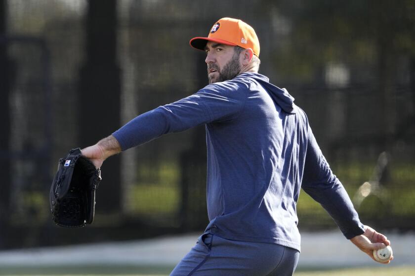 FILE - Houston Astros pitcher Justin Verlander throws during a baseball spring training workout Feb. 14, 2024, in West Palm Beach, Fla. Verlander is scheduled to make his second and likely final rehabilitation start for Double-A Corpus Christi on Saturday night, April 13. The three-time Cy Young Award winner opened the season on the injured list with inflammation in his right shoulder. (AP Photo/Jeff Roberson, File)