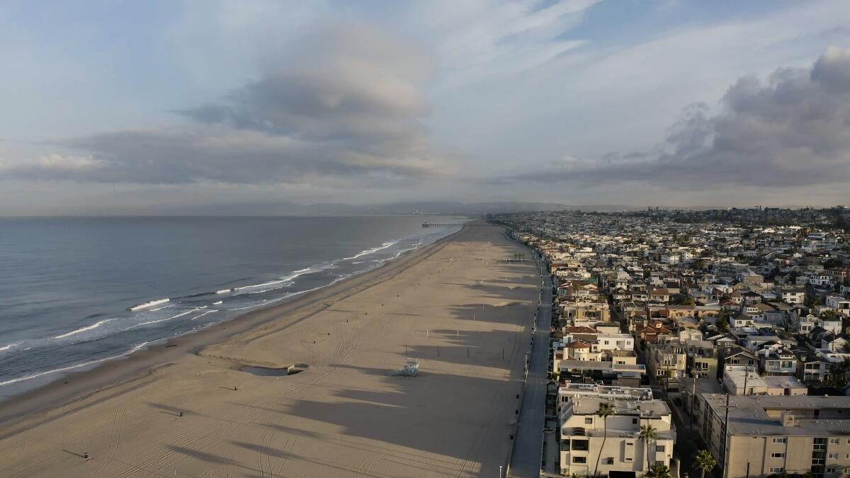 A drone's view of Hermosa Beach, looking north along the Strand, while all beaches in Los Angeles County are closed to slow the spread of the coronavirus.