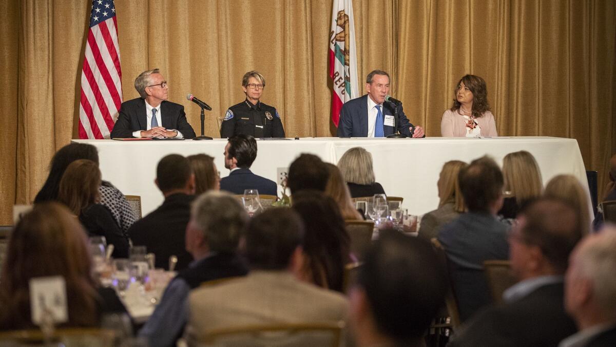 From left, Community Development Director Greg Pfost, Police Chief Laura Farinella, Mayor Bob Whalen and Assistant City Mmanager and Public Works Director Shohreh Dupuis attend the State of the City address Thursday at the Montage Laguna Beach.