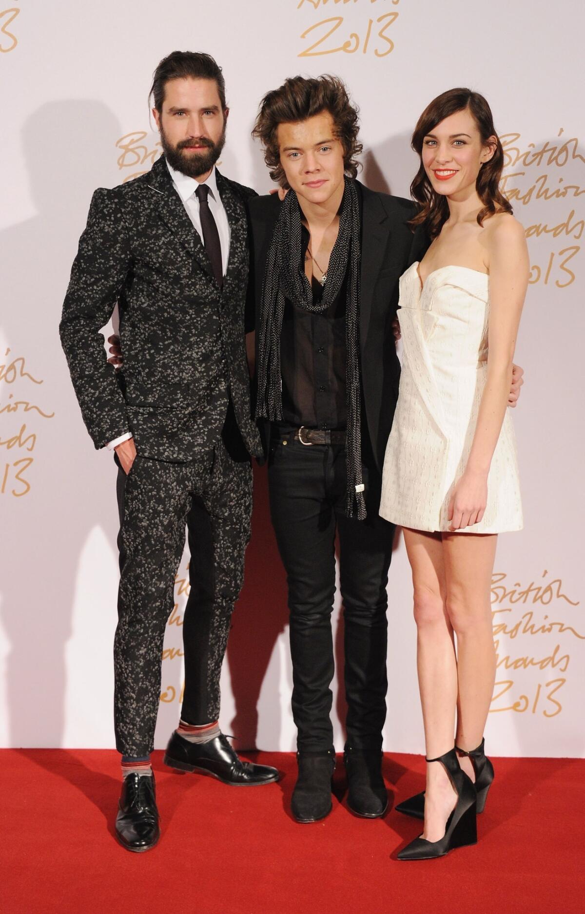 Jack Guinness, left, Harry Styles and Alexa Chung at the British Fashion Awards on Monday. Styles was recipient of the public-voted British Style Award. Guinness and Chung presented it to him.
