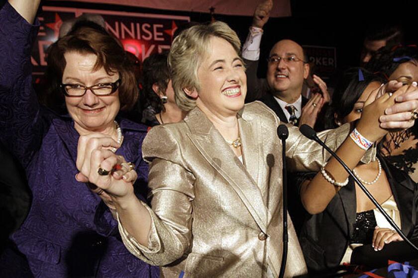 Annise Parker, center, celebrates after winning a runoff election in 2009 to become the first openly gay mayor of Houston.