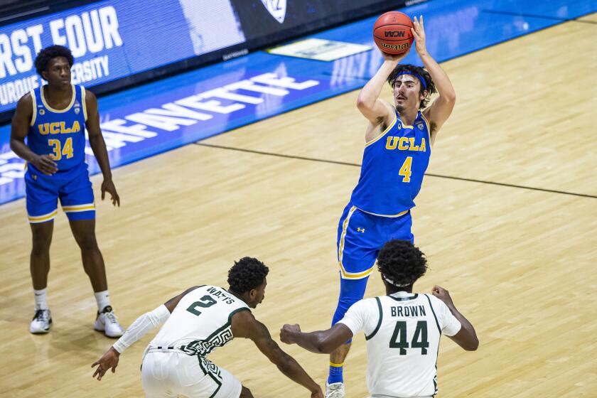 UCLA's Jaime Jaquez Jr. shoots a three-pointer during Thursday night's game. Jaquez played the entire game and scored a career-high 27 points.