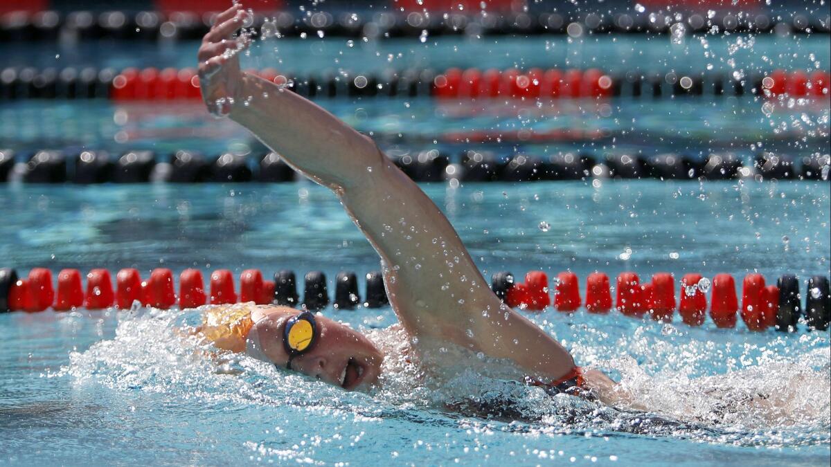 Huntington Beach High senior Natalie Crocker, shown competing in a meet on March 27, 2018, helped the Oilers break the 400-yard freestyle relay school record during Tuesday's meet at Fountain Valley.