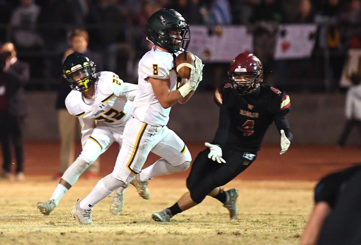 Paradise High School's Brenden Moon intercepts a pass for a touchdown.