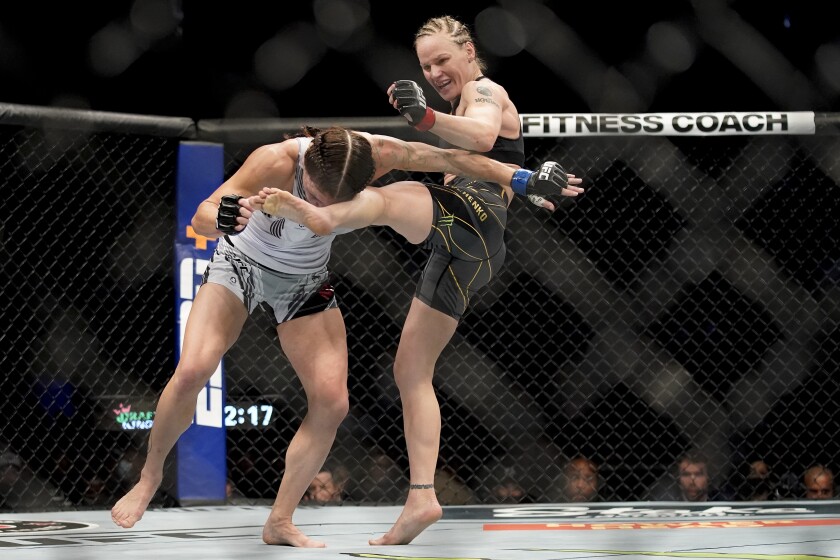Valentina Shevchenko, right, kicks Lauren Murphy during a women's flyweight.