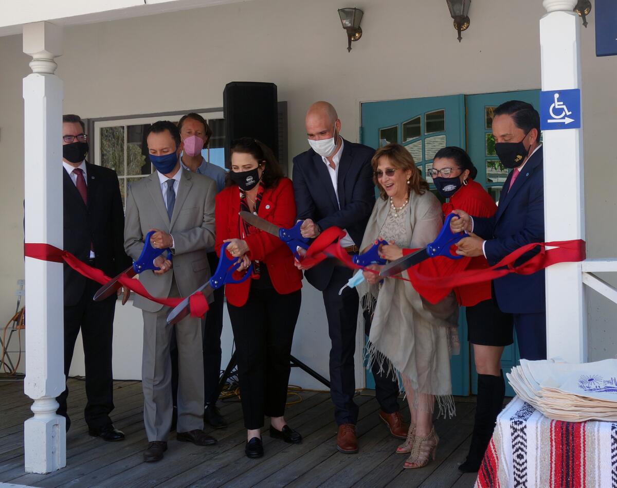 People cutting the ribbon at opening of Televisa Californias studio in Seaport Village