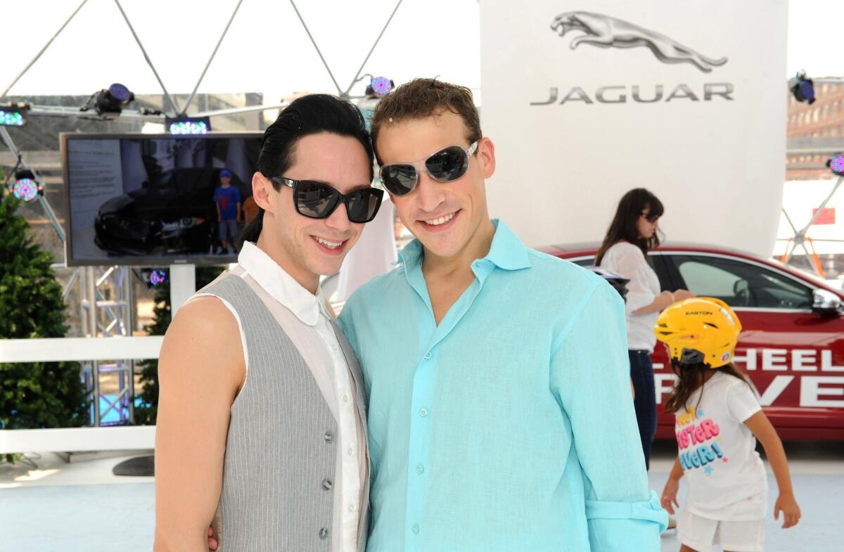 Figure skater Johnny Weir, left, has announced a split from husband Victor Voronov.