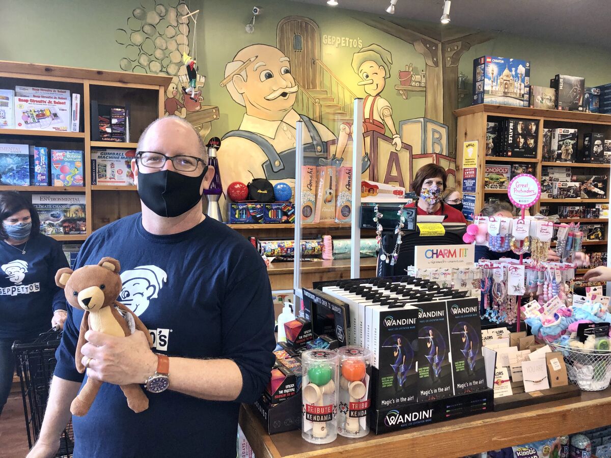 Brian Miller, president of Geppetto's Inc., and his staff helped pull 2,300 games and toys at the Del Mar store. 