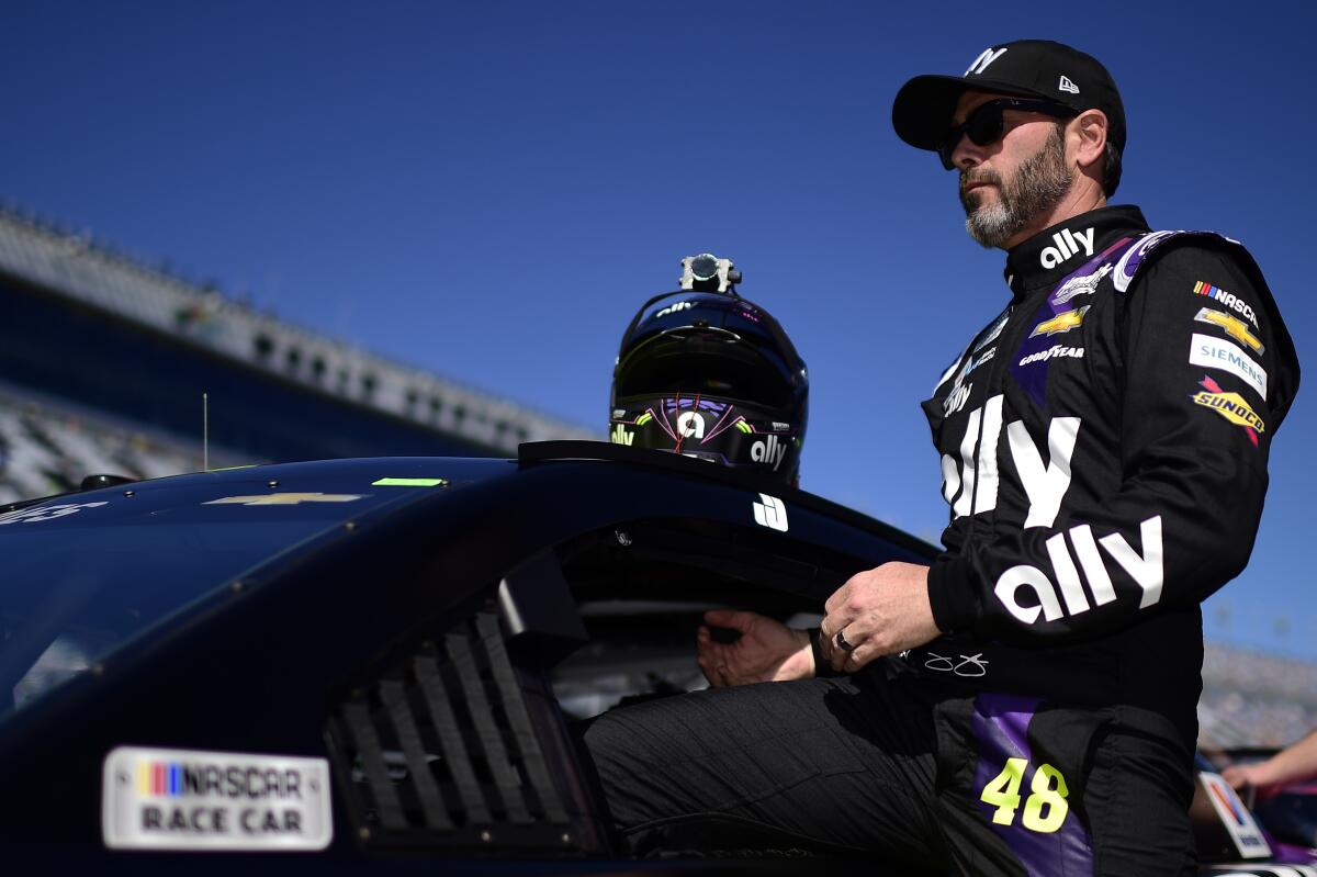 Jimmie Johnson climbs into his car Feb. 9 during qualifying for the Daytona 500.
