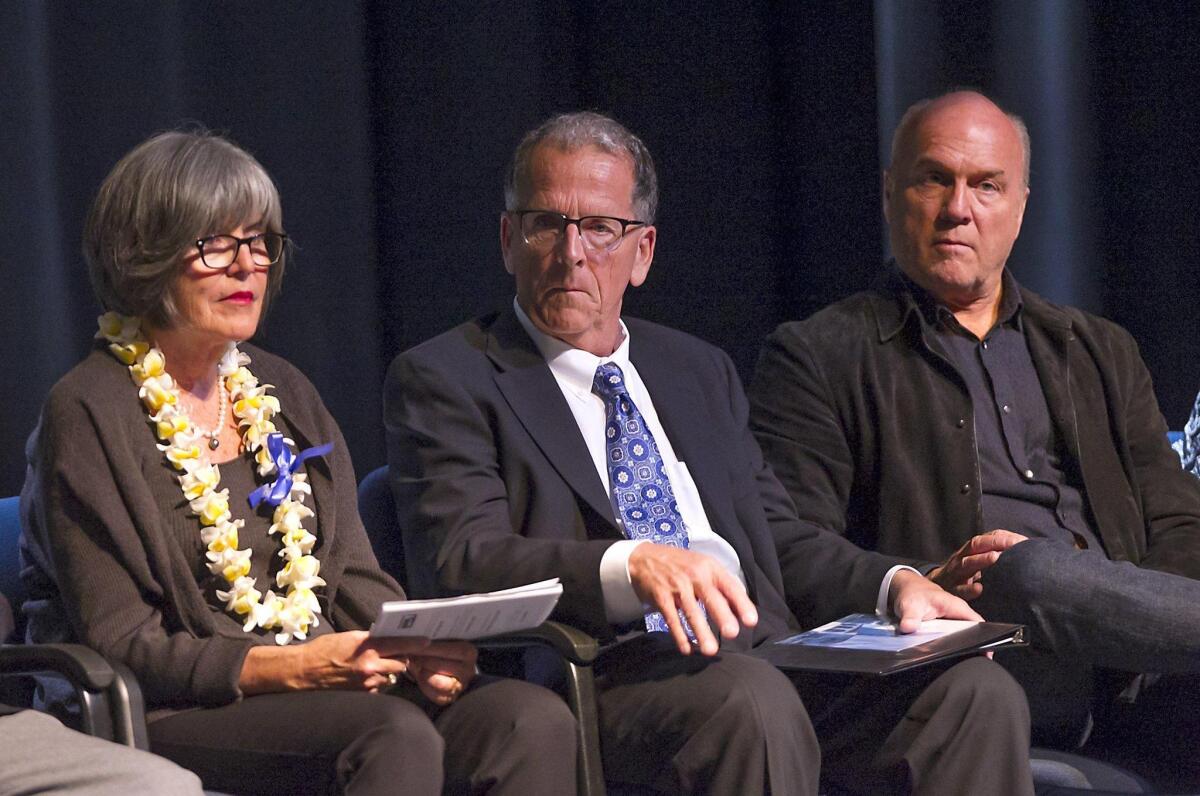 Inductees Sandi Smith, David Thompson and Greg Laurie, from left, attend the Newport Harbor High School Hall of Fame ceremony Wednesday at the school’s Robert B. Wentz Theater.