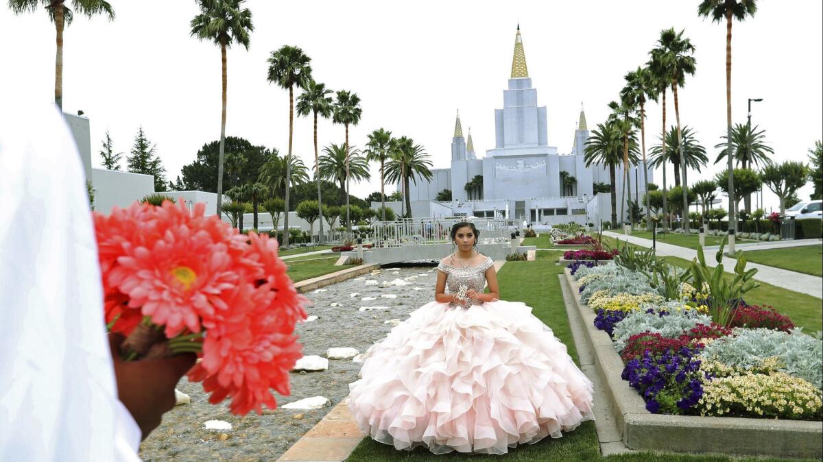 Joseline Garcia of Oakley, Calif., poses during a quinceañera photo session on June 15 at the Mormon Temple garden in Oakland.