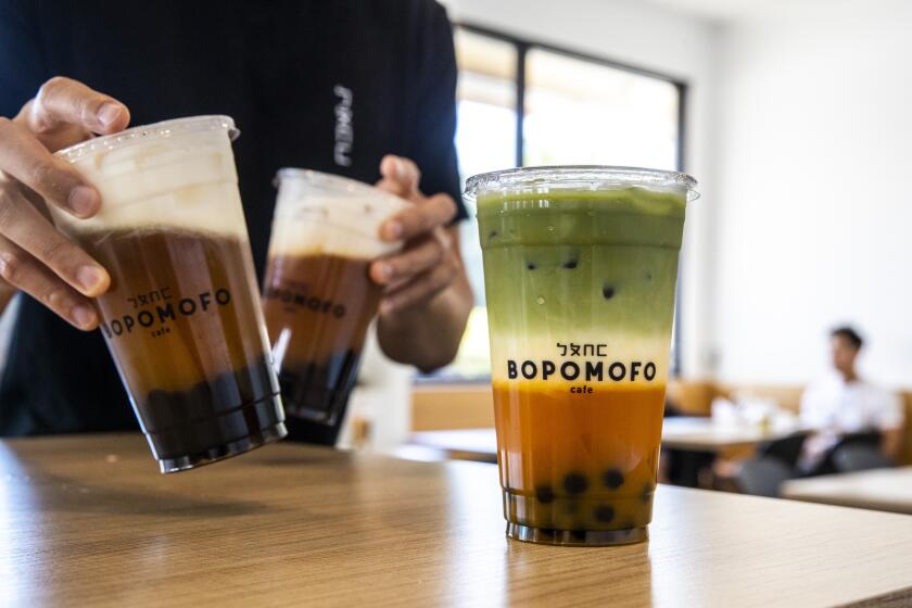 SAN GABRIEL, CALIF. -- WEDNESDAY, SEPTEMBER 25, 2019: The Carrot Matcha Latte, right, at the Bopomofo Cafe in San Gabriel, Calif., on Sept. 25, 2019. (Brian van der Brug / Los Angeles Times)