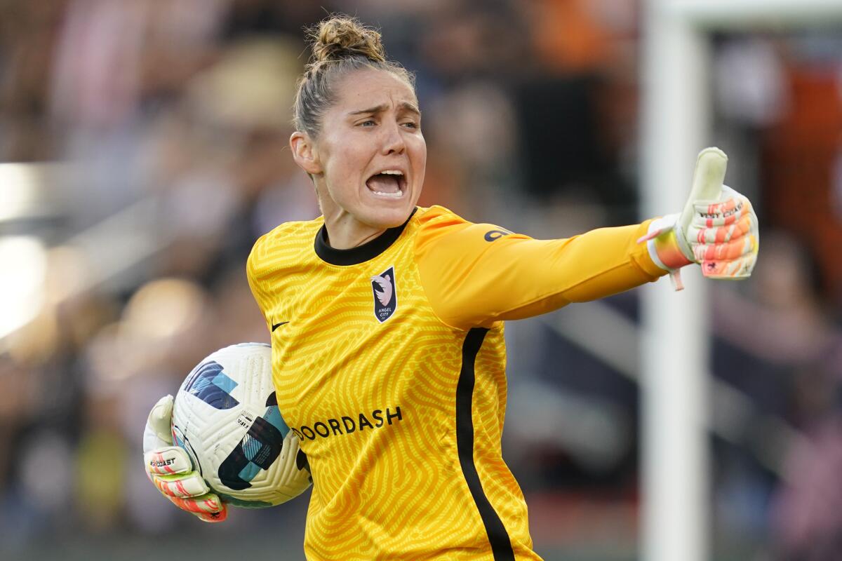 Angel City FC goalkeeper Didi Haracic gives a thumbs-up to a teammate.