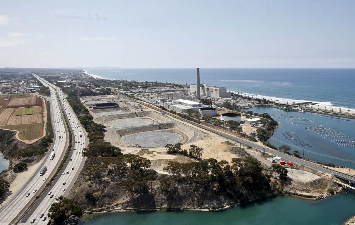 Much of San Diego County could benefit from the easing of water-conservation rules because of the desalination plant in Carlsbad, shown here in September.